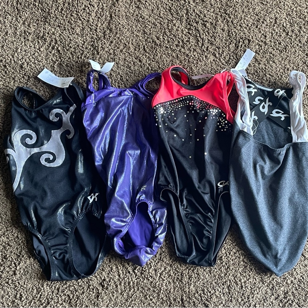 4 gymnastics leotards,  child medium
